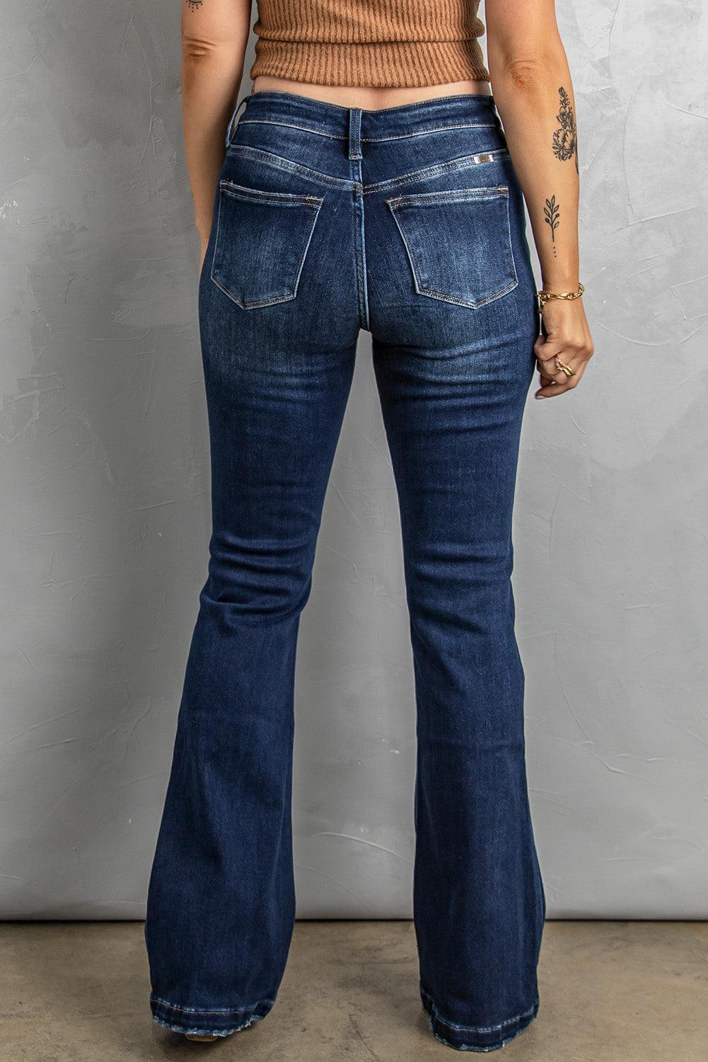 a woman in a brown top and blue jeans