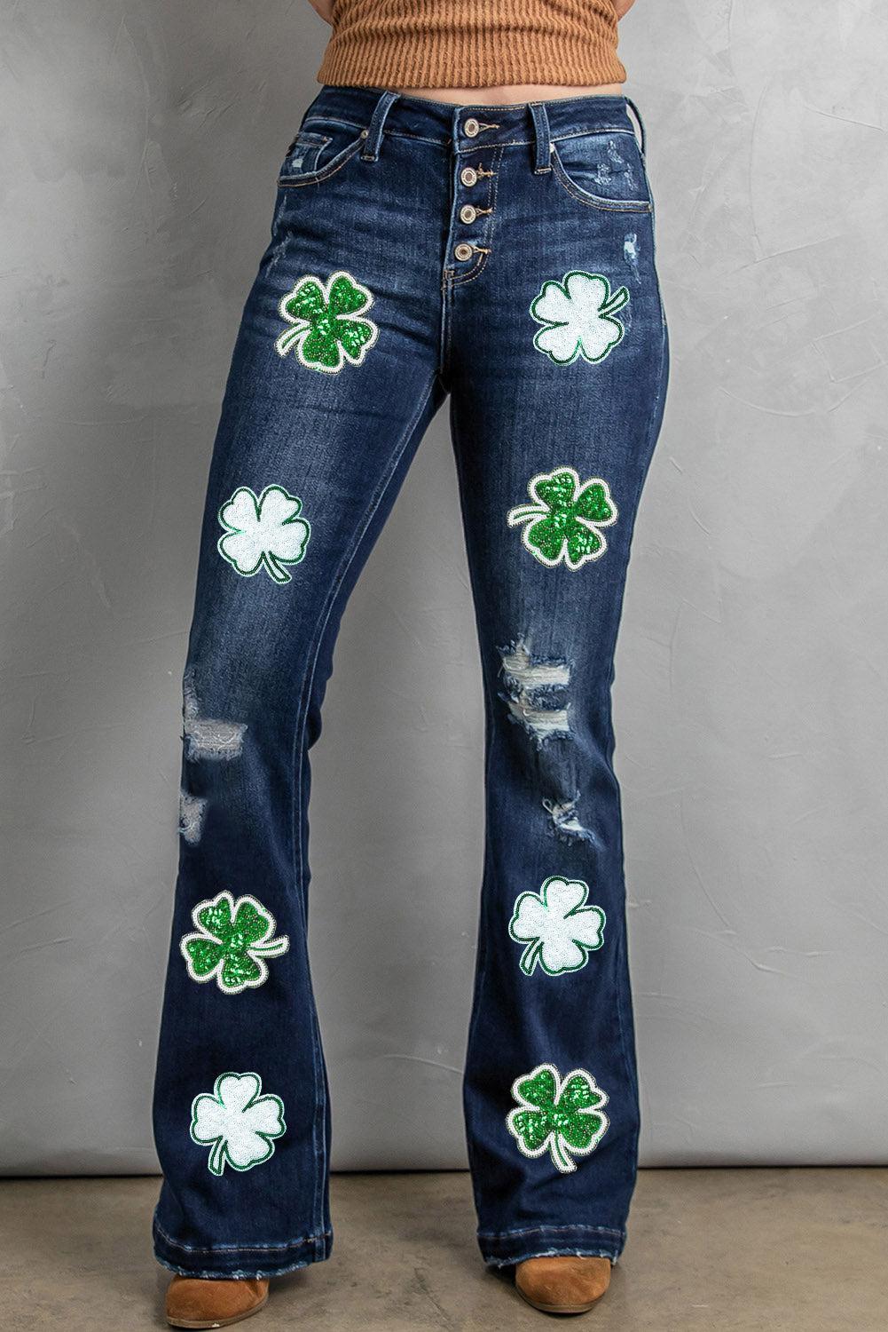 a woman wearing a pair of jeans with shamrocks on them