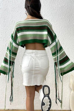 a woman wearing a green and white striped top