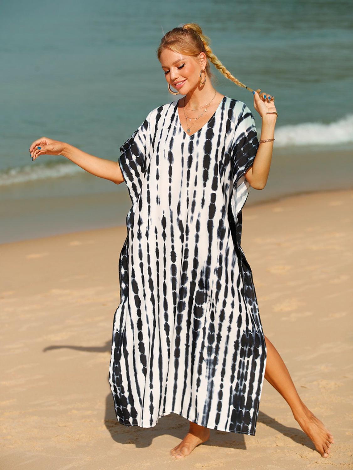 a woman standing on a beach next to the ocean