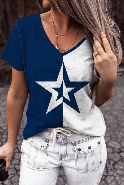 a woman wearing a blue and white star t - shirt
