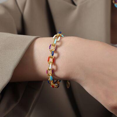 a woman wearing a bracelet with multicolored beads