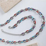 a silver chain with a red, white, and blue link