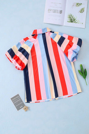 a striped shirt laying on top of a table