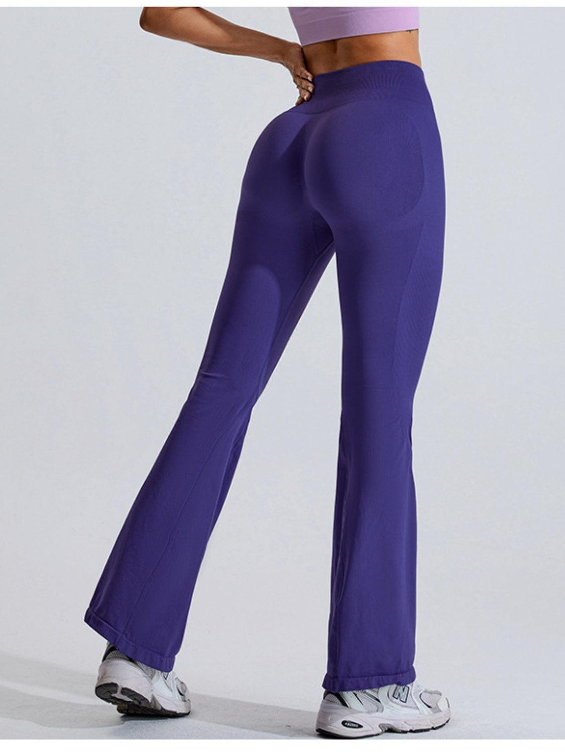 a woman in a purple top and purple pants