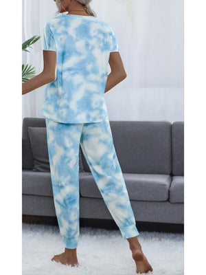 a woman wearing a blue and white tie dye pajama set
