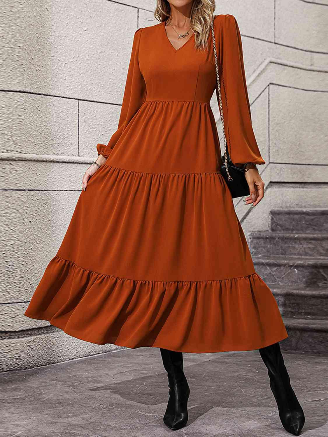 a woman in an orange dress