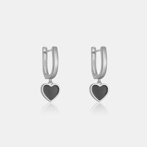 a pair of heart shaped hoop earrings