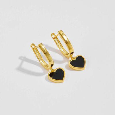 a pair of heart shaped earrings on a white background