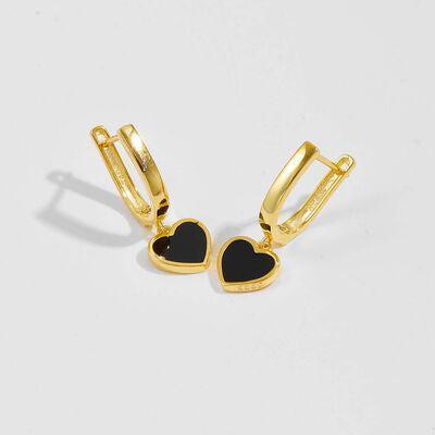 a pair of black heart shaped earrings on a white background