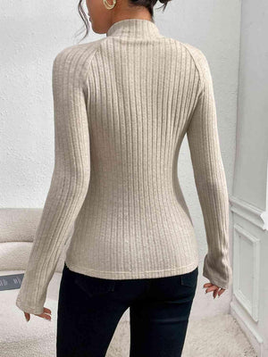 a woman wearing a turtle neck sweater