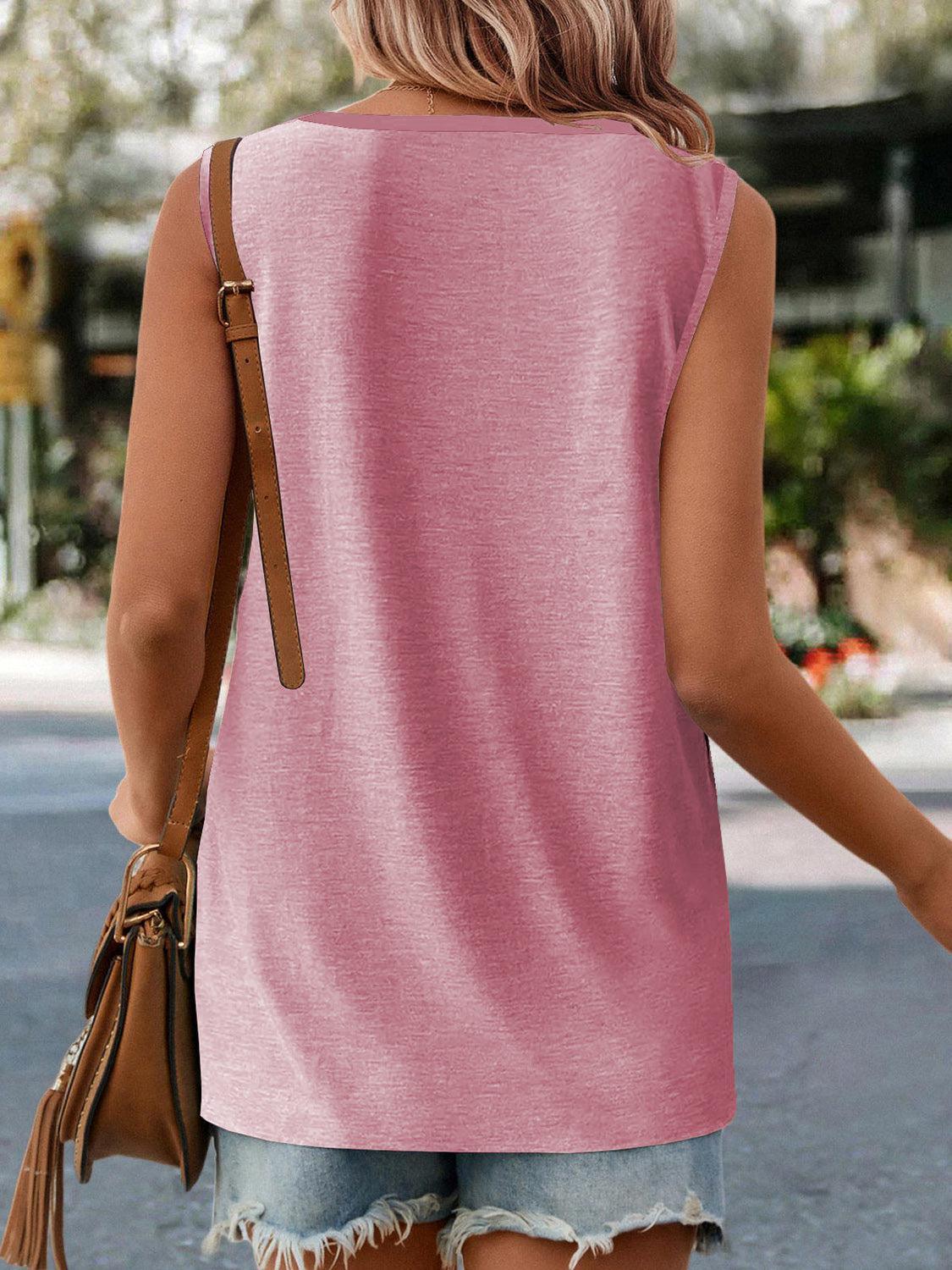 a woman walking down the street wearing a pink top