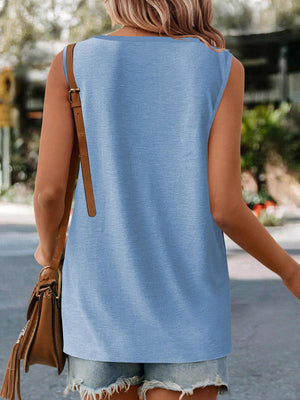 a woman walking down the street wearing a blue top