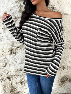 a woman wearing a black and white striped sweater