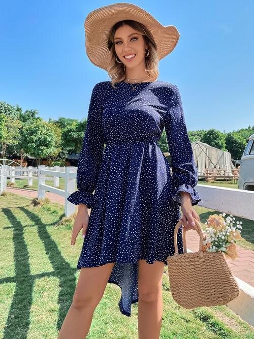 a woman wearing a blue dress and hat