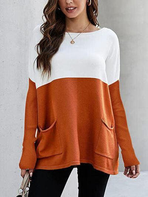 a woman wearing an orange and white sweater