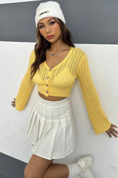 a woman in a yellow top and white skirt