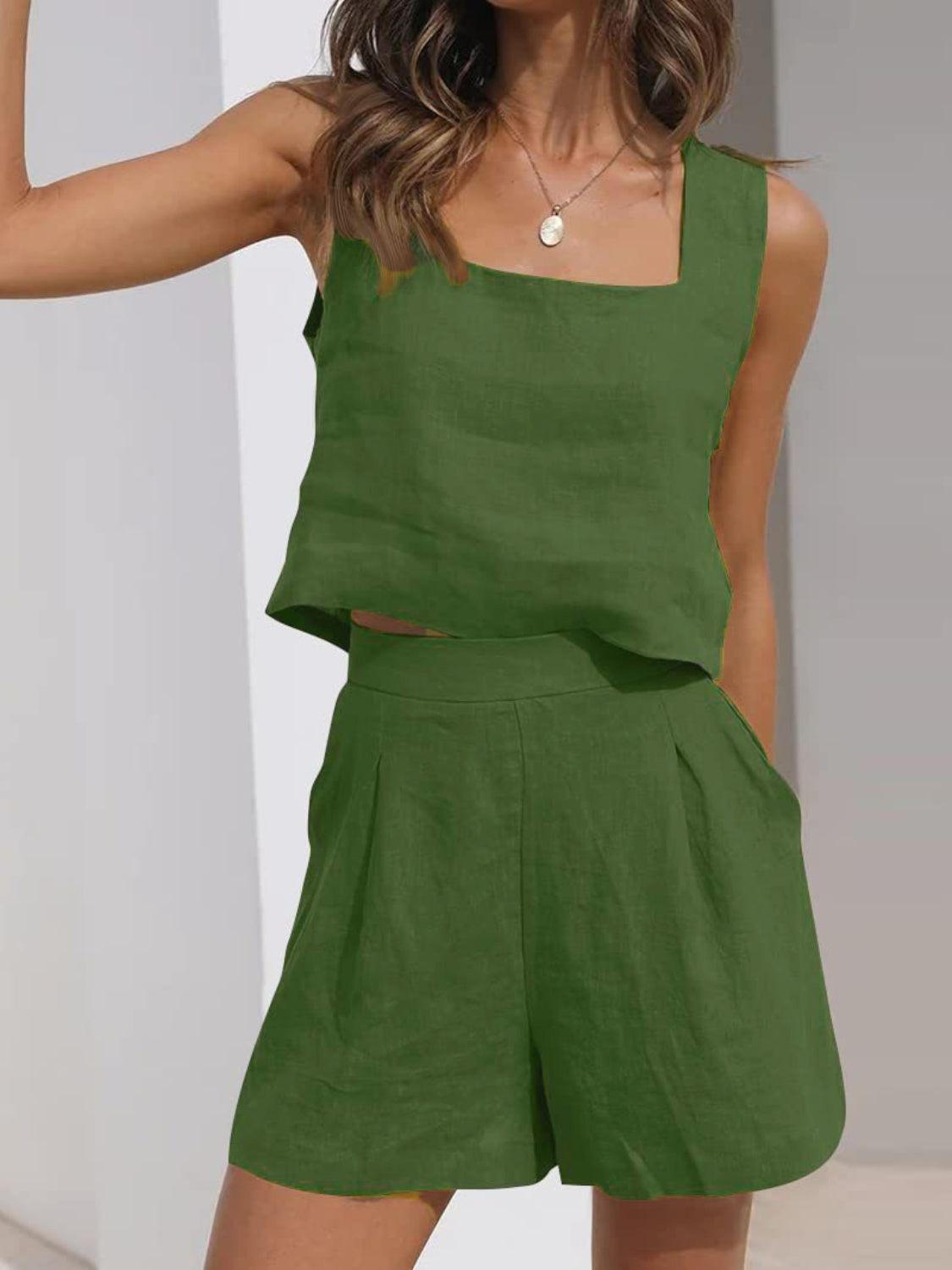 a woman wearing a green top and shorts