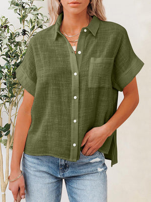 a woman wearing a green shirt and jeans