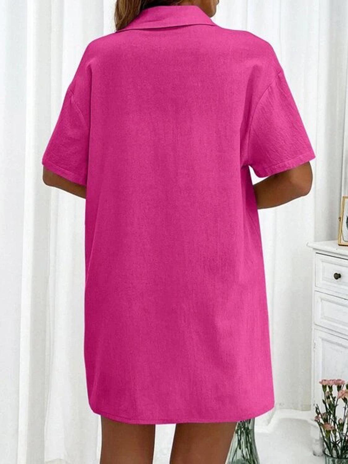 a woman in a bright pink shirt dress