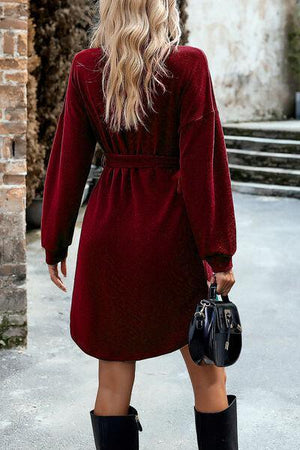 a woman in a red dress and black boots