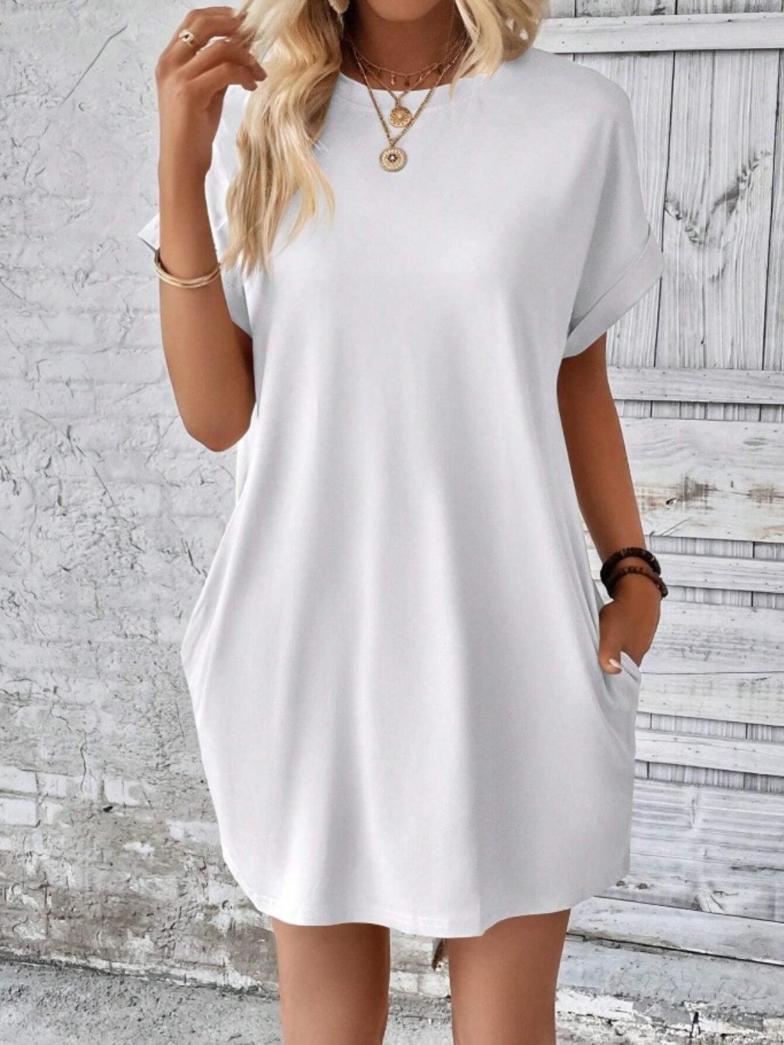 a woman wearing a white shirt dress