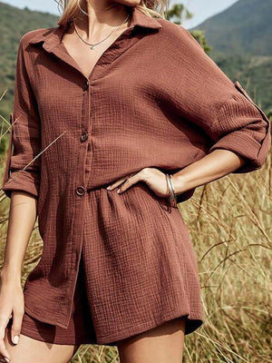 a woman standing in a field of tall grass