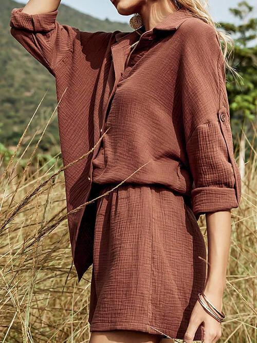 a woman standing in a field of tall grass