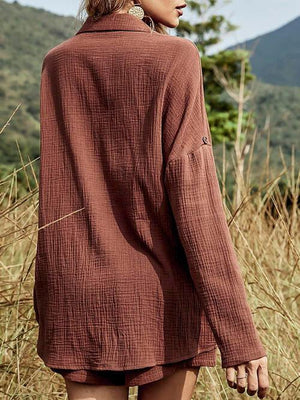 a woman standing in a field of tall grass