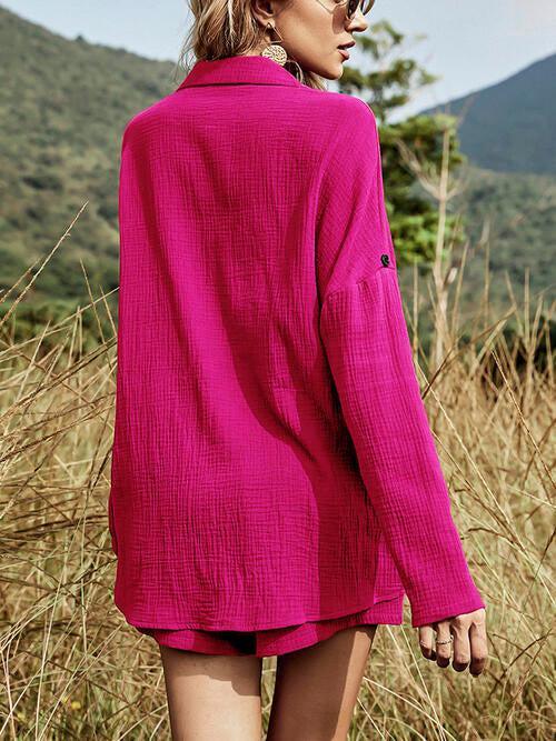 a woman in a pink shirt is standing in a field