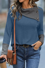 a woman with a hat and a purse walking down the street