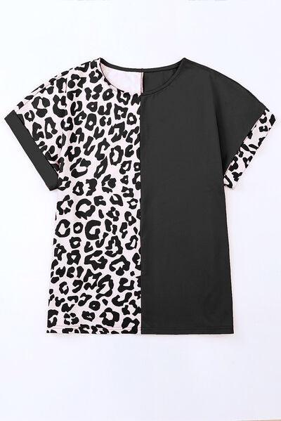 a black and white shirt with a leopard print on it
