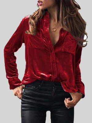 a woman wearing a red shirt and black pants