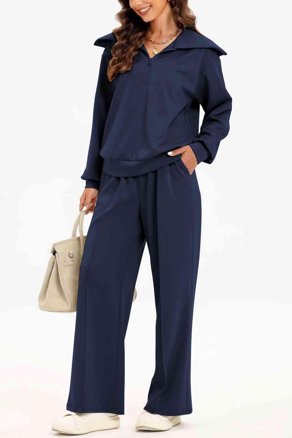 a woman wearing a blue jumpsuit and white shoes