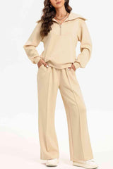 a woman in a beige sweatshirt and pants