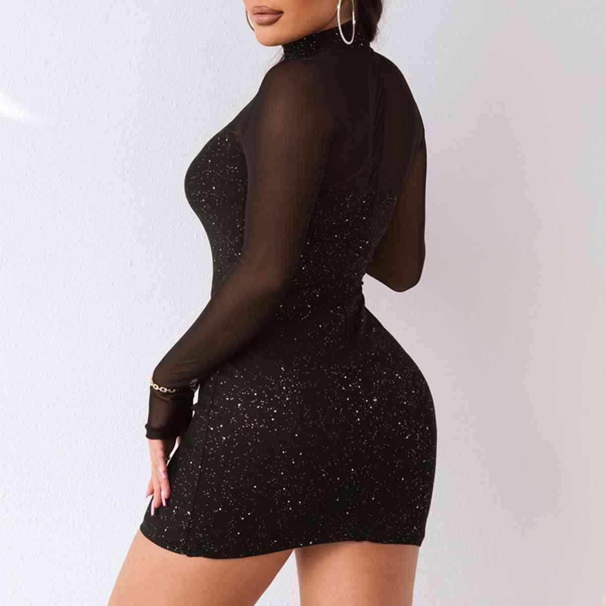 a woman in a short black dress