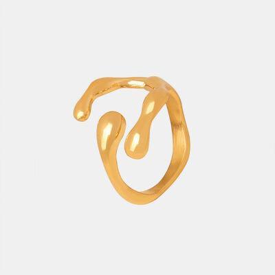 a close up of a gold ring on a white background