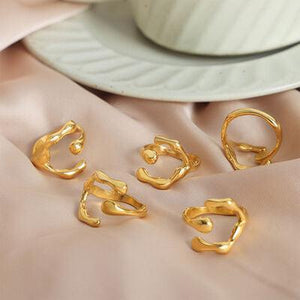 a close up of gold rings on a table