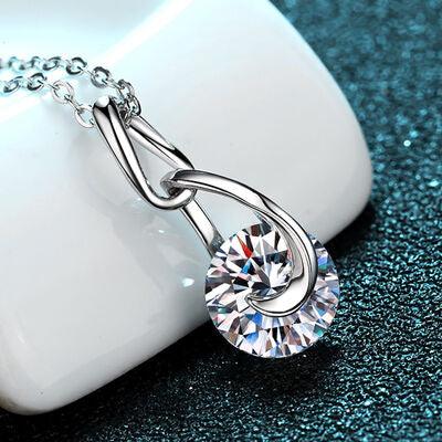 a necklace with a diamond on it