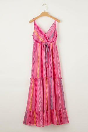 a pink dress hanging on a hanger