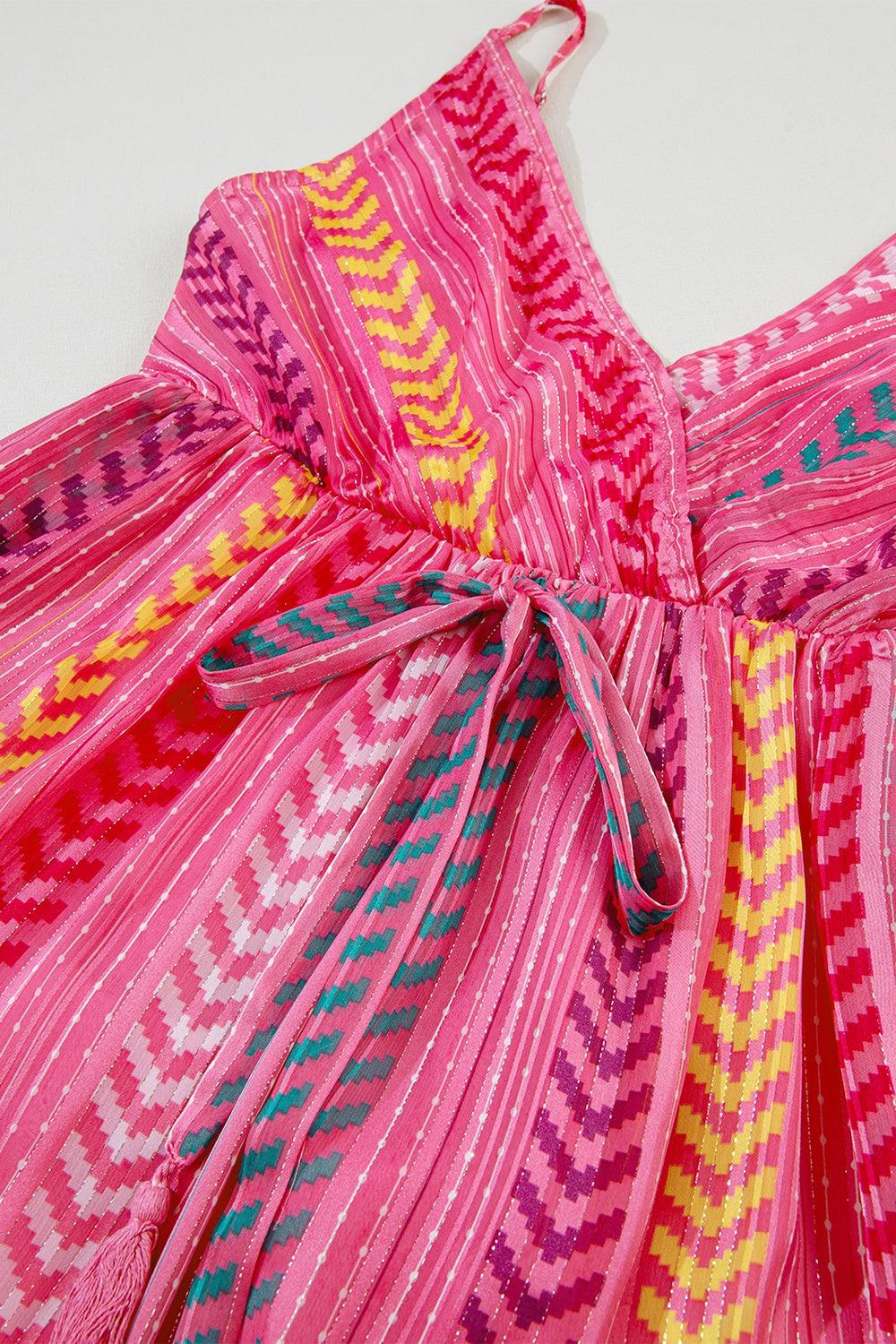 a pink dress with a colorful design on it