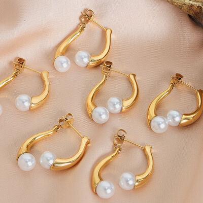 a set of five pairs of pearl hoop earrings