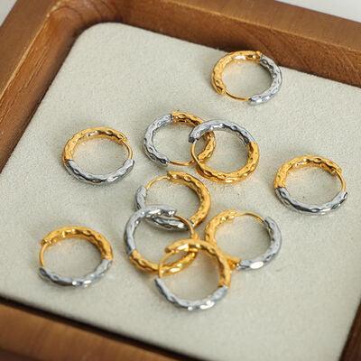 a group of gold and silver rings sitting on top of a tray