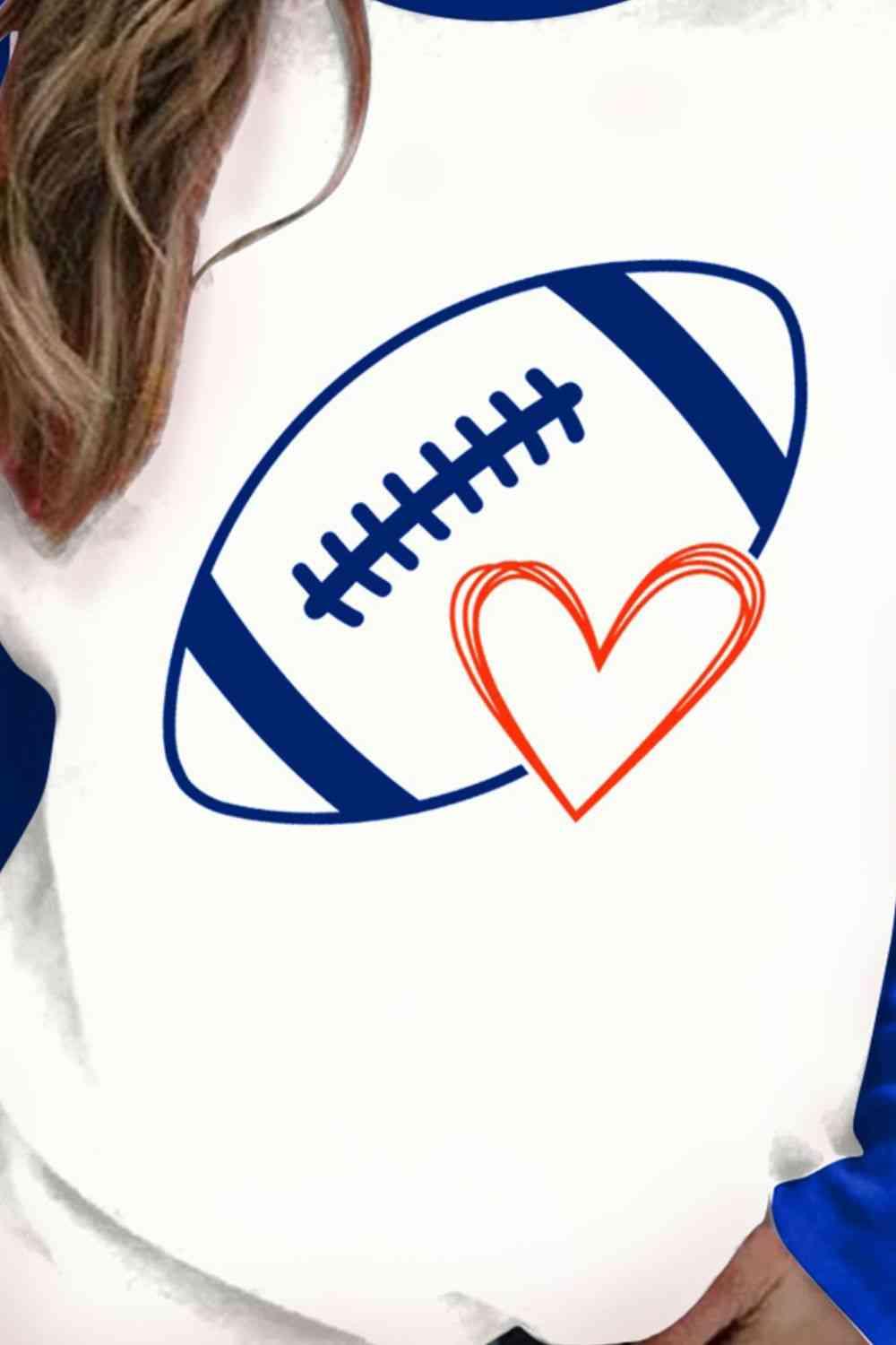 a woman wearing a football shirt with a heart on it