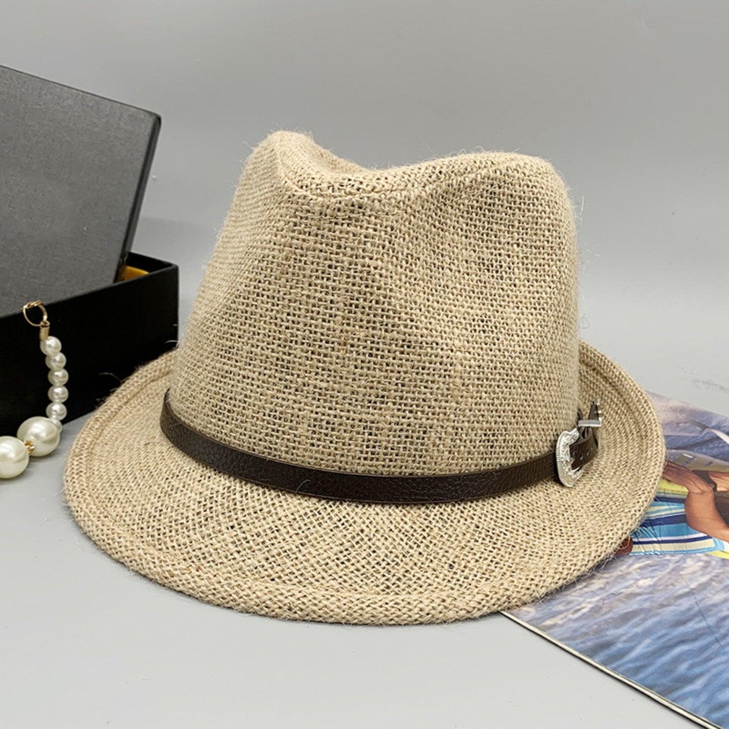 a hat and a necklace on a table