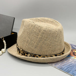 a hat and a necklace on a table