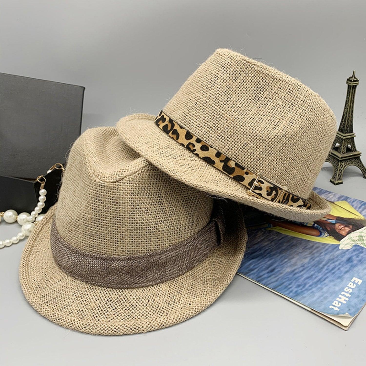 a hat and a book on a table