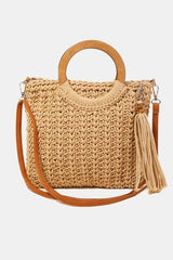 a straw bag with a wooden handle