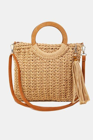 a straw bag with a wooden handle