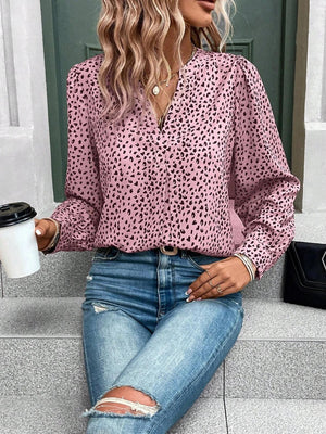 a woman sitting on the steps with a cup of coffee